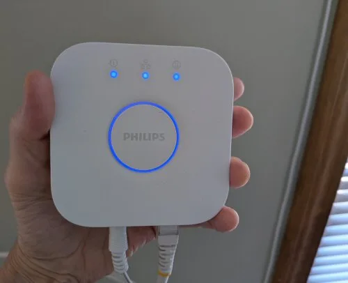Philips Hue Bridge second generation with power and Ethernet cables connected